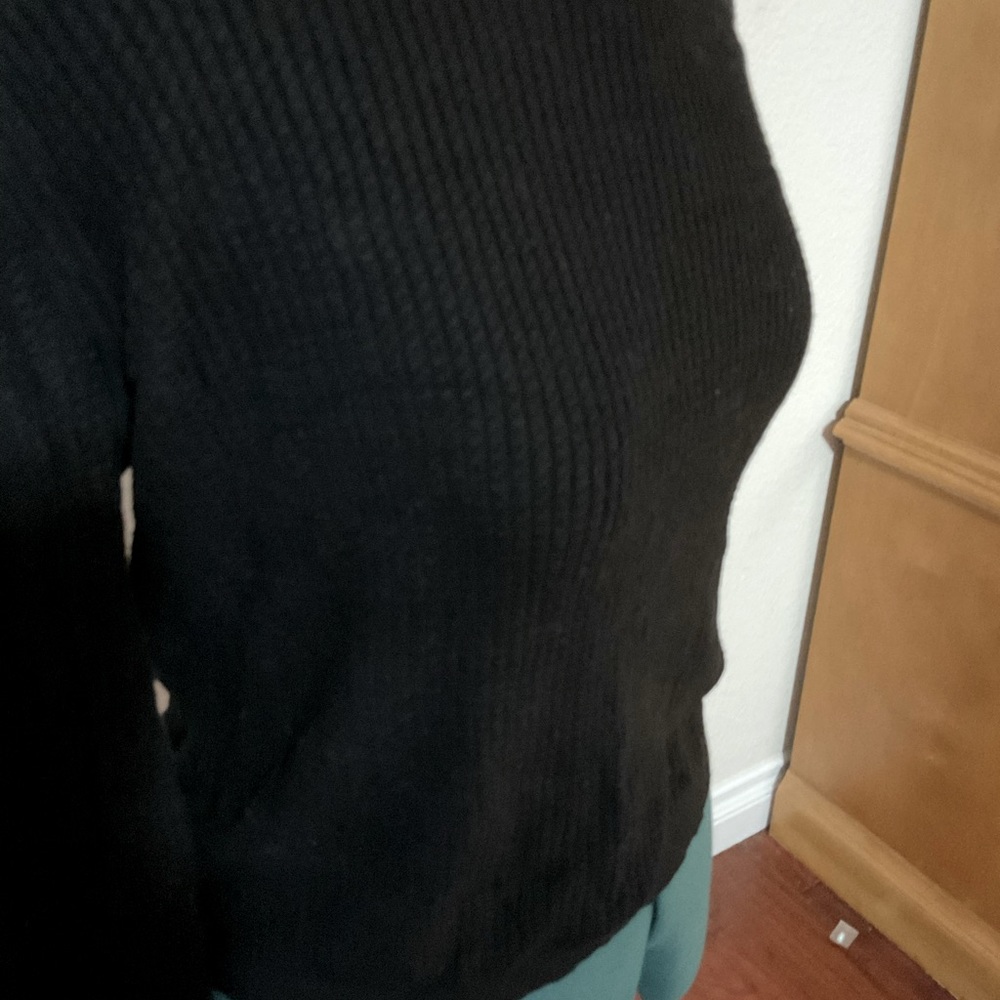 Black long sleeve sweater with sexy back opening